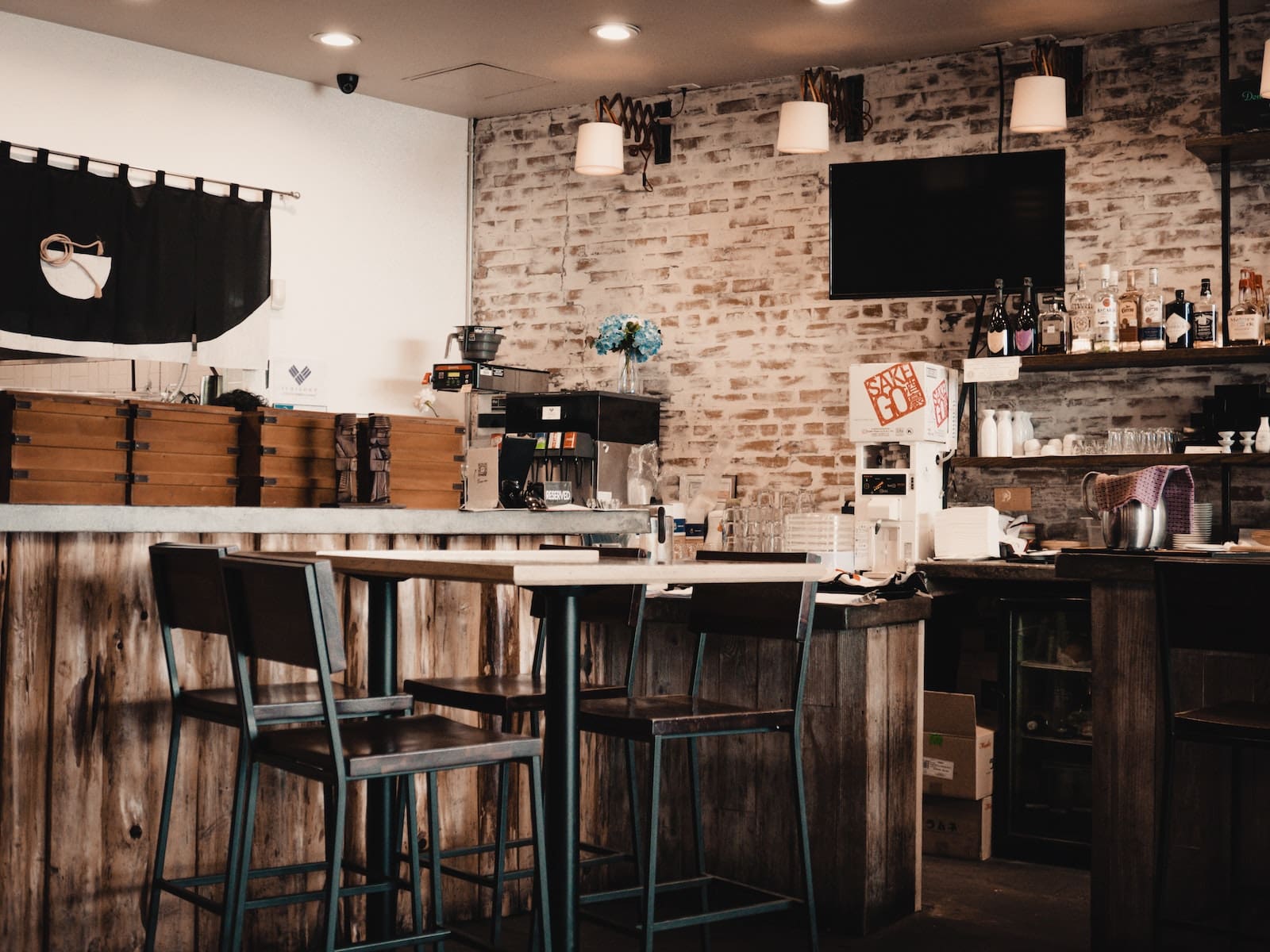 TV and discrete speakers in a bar